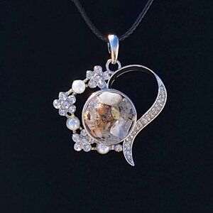 Phenomenal Gold Rutilated heart with 24 inch cord necklace